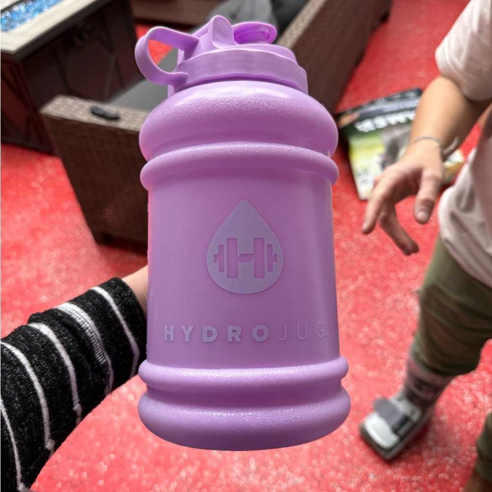 HydroJug Lavender Hydration Bottle with leopard carrying cover